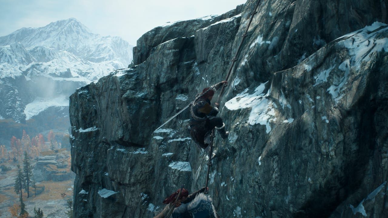 Offizieller Screenshot von Dragon's Dogma 2: Dark Arisen: der Arisen klettert eine verschneite Norgan-Klippe
